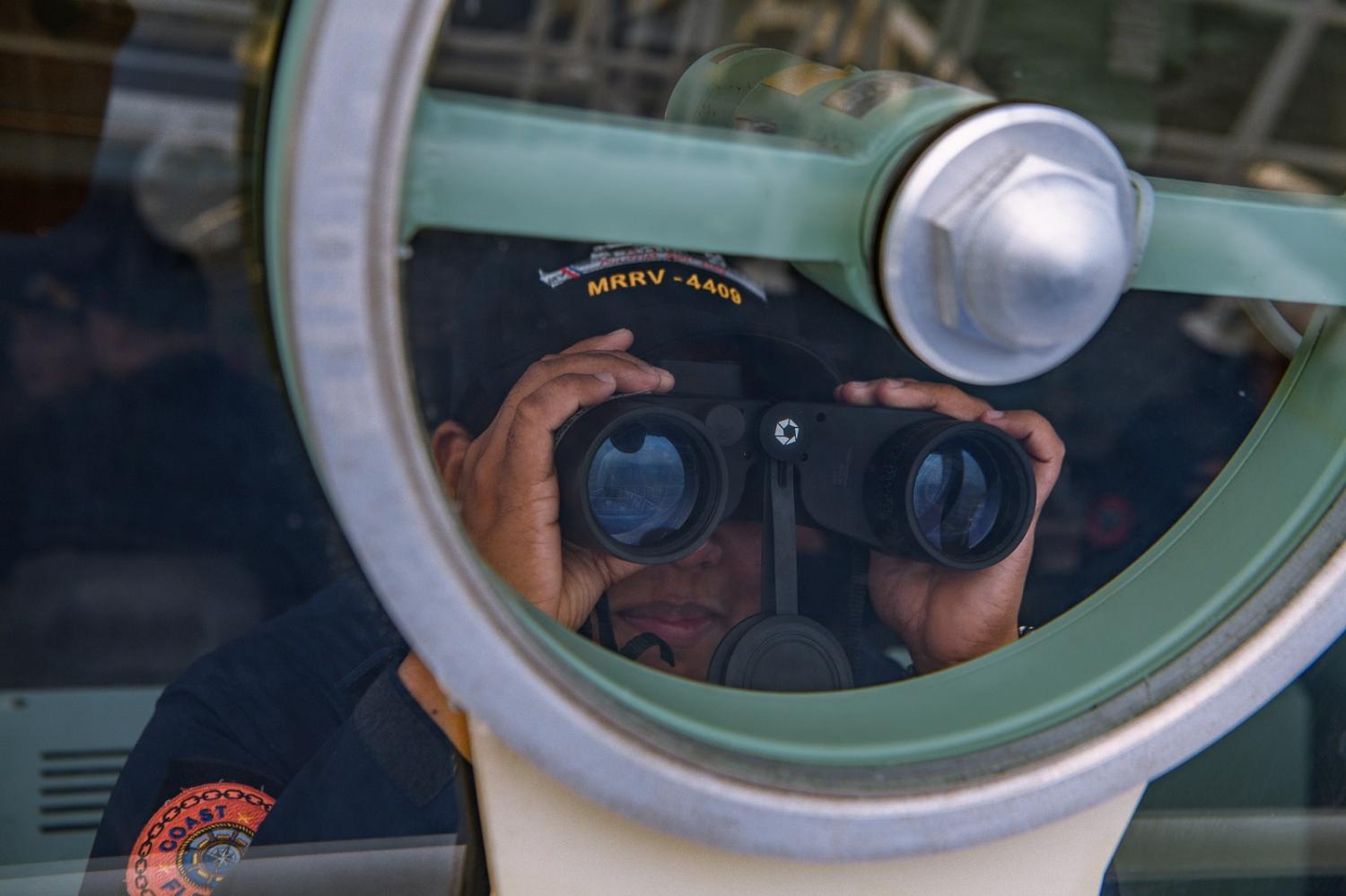 The Philippine Coast Guard takes part in a simulation during a trilateral maritime exercise with Japan and US coast guards on 6 June 2023 (Jes Aznar/Getty Images)